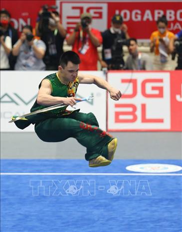 VĐV Nông Văn Hữu (Việt Nam) với bài biểu diễn nội dung Nam đao nam đạt 9,67 điểm, giành HCĐ. Ảnh: Phạm Hậu - TTXVN
