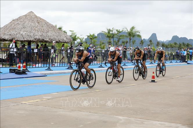 Photo: Athletes during the triathlon competitions. VNA Photo: Công Đạt