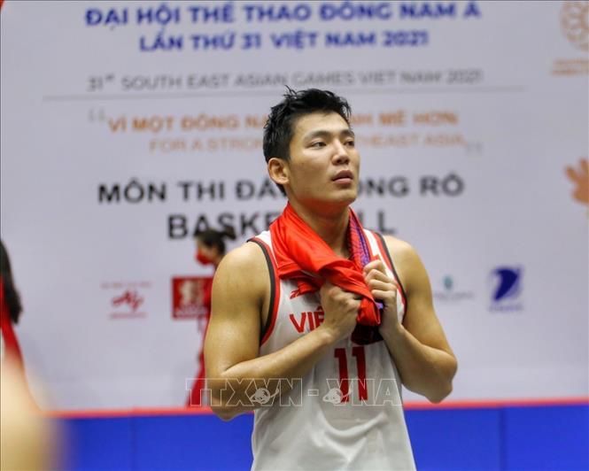 Sự nuối tiếc của Võ Kim Bản (số 11, nam Việt Nam) sau trận đấu với nam Thái Lan. Ảnh: Tuấn Đức - TTXVN