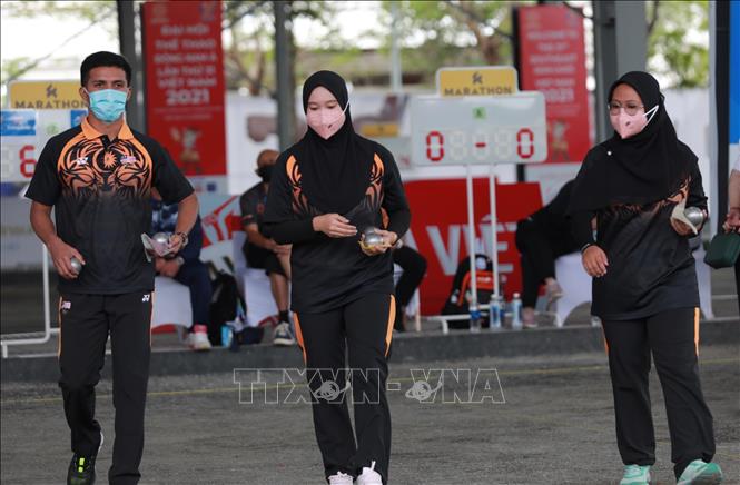 Đội Malaysia thi đấu vòng loại. Ảnh: Hoàng Hiếu - TTXVN 