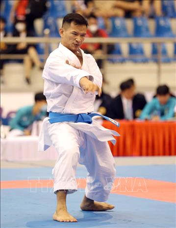 VĐV Kimchea Theng, Campuchia thi đấu vòng một nội dung Kata nam. Ảnh: Thanh Tùng – TTXVN