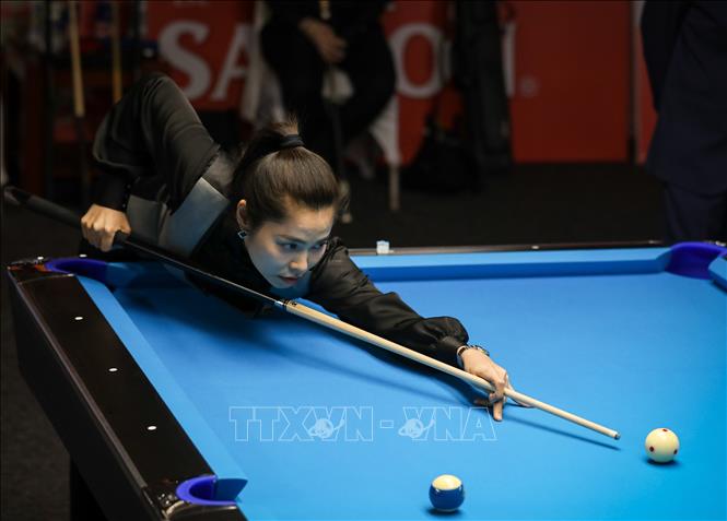 VĐV Trần Thị Ngọc Huyền (Việt Nam) thi đấu nội dung 10-Ball Pool nữ. Ảnh: Khánh Hoà - TTXVN 