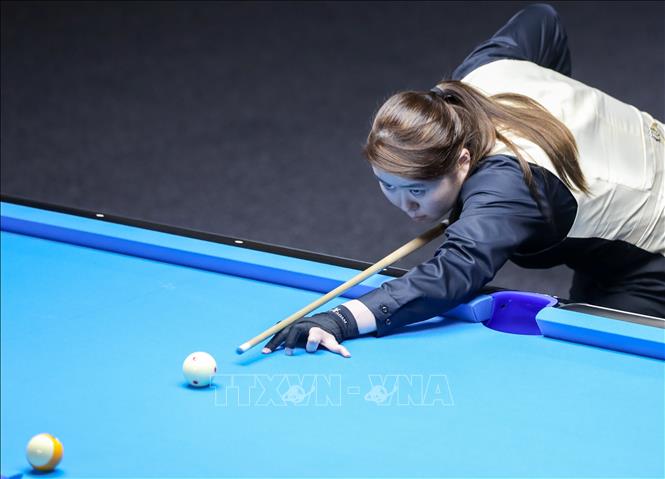 VĐV Tan Hui Ming (Singapore) thi đấu nội dung 10-Ball Pool nữ. Ảnh: Khánh Hoà - TTXVN 
