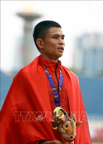 Vo Xuan Vinh  wins a gold from the 20km walk race for men. VNA Photo: Huy Hùng