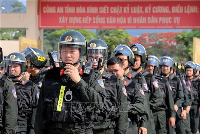 Trong ảnh: Tập trung cao độ của lực lượng Tiểu đoàn Cảnh sát cơ động dự bị chiến đấu Công an tỉnh Hòa Bình. Ảnh: Thanh Hải - TTXVN 