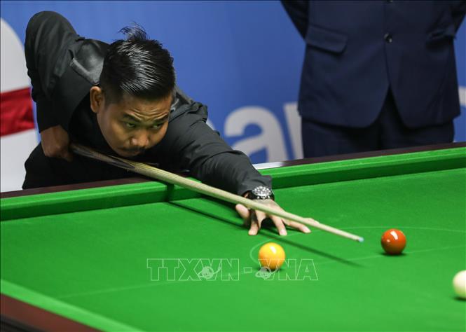 VĐV Aung Phyo (Myanmar) thi đấu nội dung Snooker. Ảnh: Khánh Hoà - TTXVN