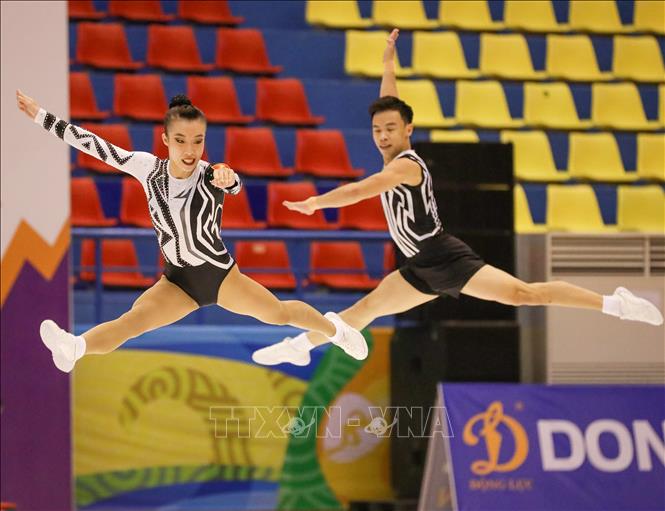 Đội Aerobic Việt Nam thi đấu nội dung nhóm bài 3 người. Ảnh: Khánh Hoà - TTXVN