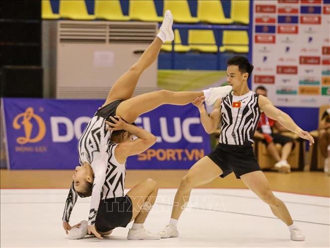 Đội Aerobic Việt Nam thi đấu nội dung nhóm bài 3 người. Ảnh: Khánh Hoà - TTXVN