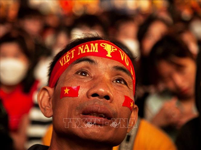 Trong ảnh: Người hâm mộ TP.Hồ Chí Minh khi chứng kiến đội tuyển U23 thi đấu. Ảnh: Hồng Đạt - TTXVN
