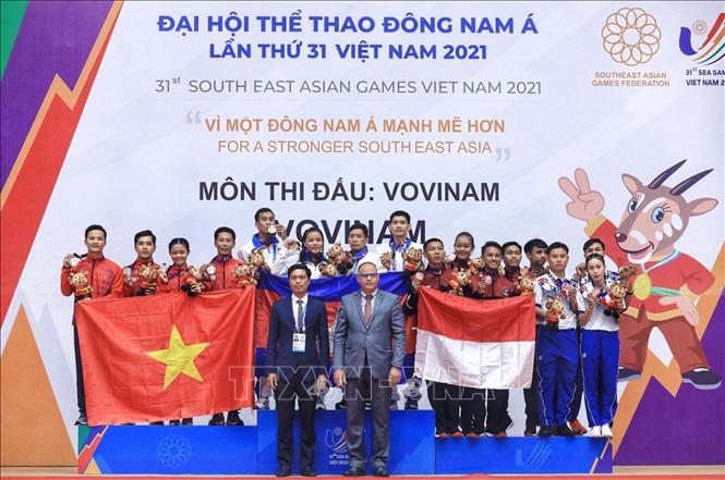 4 VĐV Lâm Thị Thùy Mỵ, Lê Toàn Trung, Lâm Trí Linh và Trần Tấn Lập đạt HCB môn Vovinam. Ảnh: Tuấn Anh-TTXVN