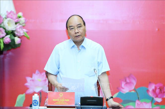 President Nguyen Xuan Phuc chairs the second meeting of the National Defence and Security Council. VNA Photo: Minh Đức