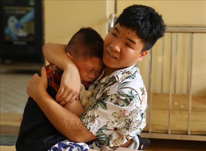 Hiện Làng đang chăm sóc, nuôi dưỡng 22 em khuyết tật (15 em bị khuyết tật nặng và đặc biệt nặng). Ảnh: Hoàng Hiếu - TTXVN 