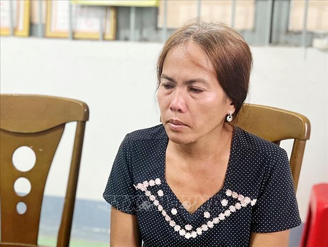 Đối tượng Nguyễn Thị Lệ tại cơ quan điều tra. Ảnh: TTXVN phát