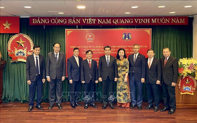 The Lao and HCM City delegates attending the working session. VNA Photo: Hồng Giang