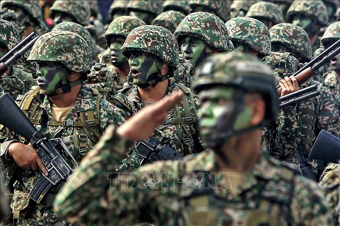 Trong ảnh: Thành viên của Quân đội Hoàng gia tham dự lễ diễu hành nhân dịp Quốc khánh. Ảnh: TTXVN phát
