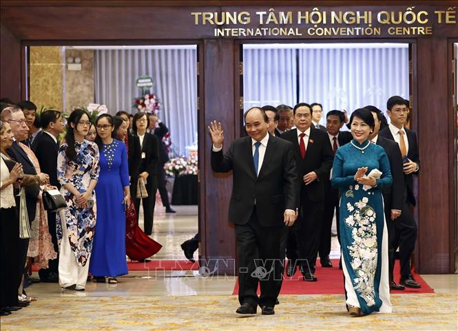 Chủ tịch nước Nguyễn Xuân Phúc và Phu nhân đến dự Lễ kỷ niệm. Ảnh: Thống Nhất - TTXVN
