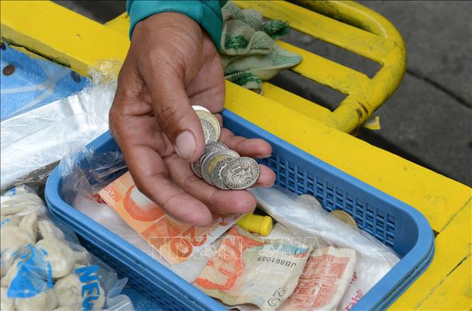 Trong ảnh: Đồng peso của Philippines. Ảnh: AFP/TTXVN