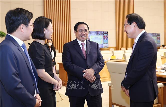 Thủ tướng Phạm Minh Chính với các đại biểu dự Hội nghị phát triển thị trường khoa học và công nghệ. Ảnh: Dương Giang-TTXVN
