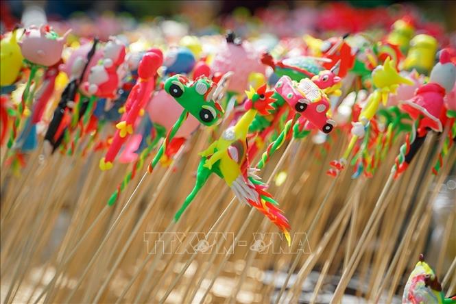 Toy figurines’ four basic colours are yellow, red, blue and black. VNA Photo: Khánh Hòa
