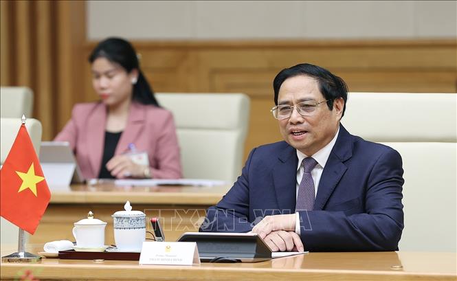 Prime Minister Pham Minh Chinh speaks at the reception for President of Singapore Halimah Yacob. VNA Photo: Dương Giang