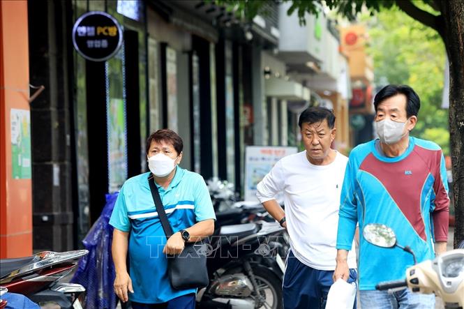 Dù chưa thực sự hòa nhập với cuộc sống ở Việt Nam nhưng đa số người Hàn đều khá hài lòng với cuộc sống của mình. Ảnh: Tuấn Anh - TTXVN