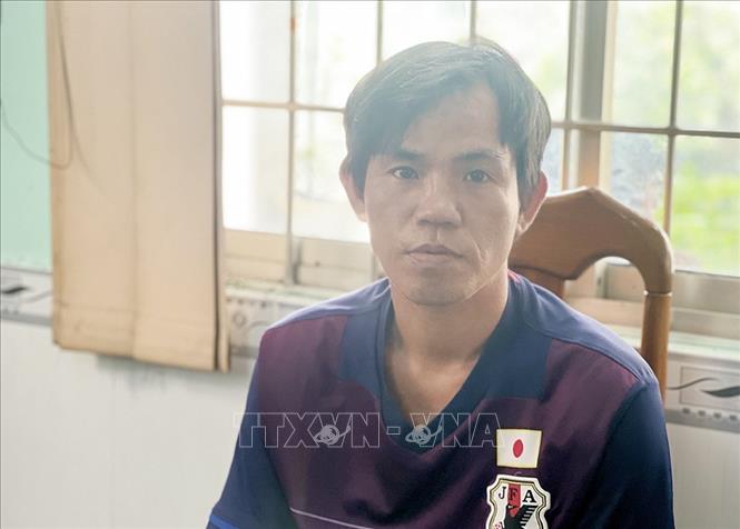 Trong ảnh: Đối tượng Trần Văn Nam tại cơ quan điều tra. Ảnh: TTXVN phát./.