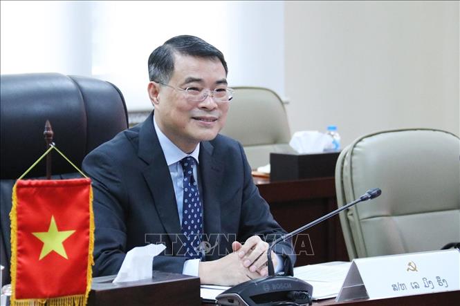 Đồng chí Lê Minh Hưng tại cuộc hội đàm với đoàn Văn phòng Trung ương Đảng NDCM Lào. Ảnh: Phạm Kiên - Phóng viên TTXVN tại Lào