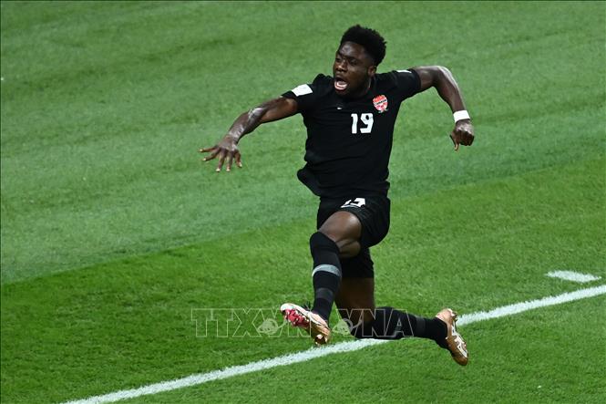 Niềm vui của tiền đạo Alphonso Davies sau khi ghi bàn thắng mở tỷ số vào lưới đội tuyển Coatia. Ảnh: AFP/TTXVN