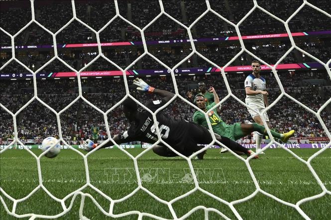 Jordan Henderson (phải) ghi bàn thắng mở tỉ số cho Anh trước Senegal. Ảnh: THX/ TTXVN