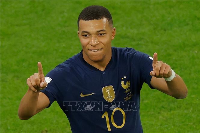 Trong ảnh: Tiền đạo tuyển Pháp Kylian Mbappe ăn mừng bàn thắng thứ hai vào lưới Ba Lan trong trận đấu vòng 1/8 Wolrd Cup 2022 ở Doha, Qatar ngày 4/12/2022. Ảnh: AFP/TTXVN