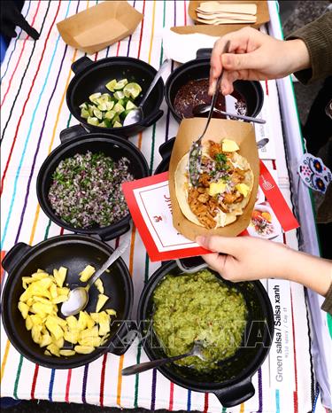 Visitors can enjoy different dishes from various countries at the festival. VNA Photo: Lâm Khánh
