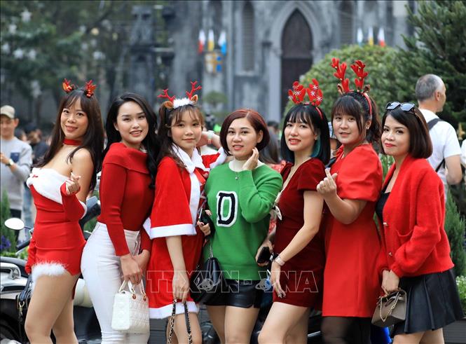 The St. Joseph's Cathedral is the largest and busiest Christmas location in Hanoi, where locals love to come during Christmas. VNA Photo 