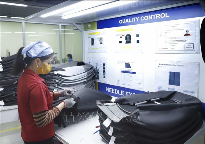 Production of the Korean-invested Cellmech International Vina Co. Ltd at the Khai Quang IP. VNA Photo: Hoàng Hùng
