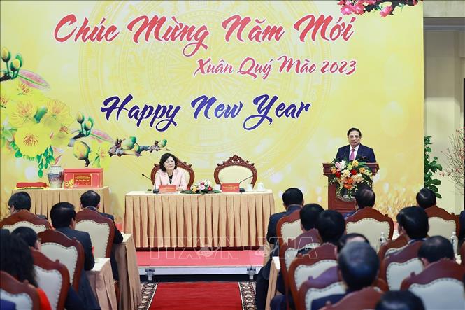 Thủ tướng Phạm Minh Chính chúc Tết và giao nhiệm vụ cho ngành Ngân hàng. Ảnh: Dương Giang-TTXVN
