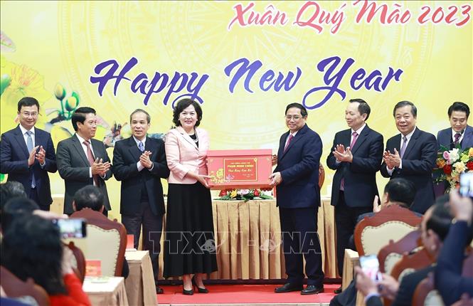 Thủ tướng Phạm Minh Chính chúc Tết ngành Ngân hàng. Ảnh: Dương Giang-TTXVN