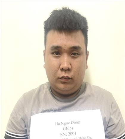 Đối tượng cướp giật tài sản Hà Ngọc Dũng tại cơ quan Công an huyện Nhơn Trạch. Ảnh: TTXVN phát