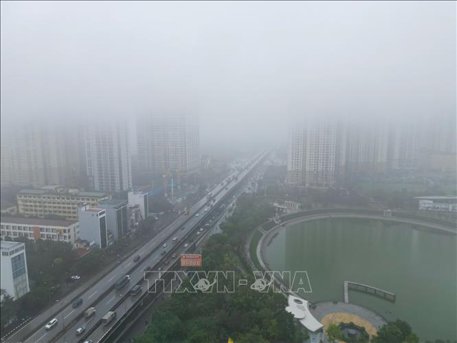 Tu Liem residential area in misty drizzle. VNA Photo: Tuấn Anh