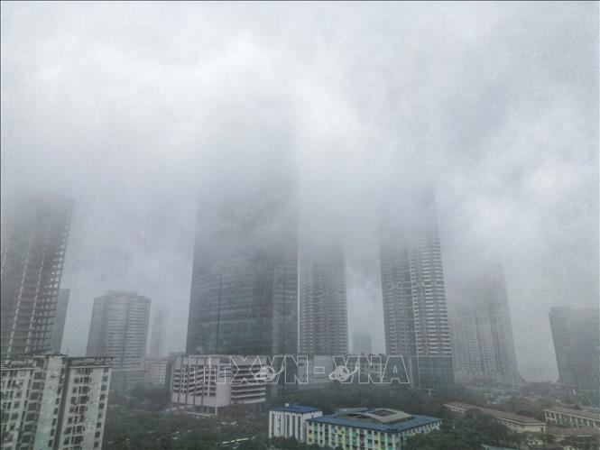 Landmark 72 building on Pham Hung street is hidden behind grey clouds. VNA Photo: Tuấn Anh