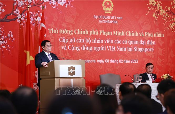 Thủ tướng Phạm Minh Chính phát biểu tại buổi gặp gỡ cán bộ, nhân viên các cơ quan đại diện và cộng đồng người Việt Nam tại Singapore. Ảnh: Dương Giang-TTXVN
