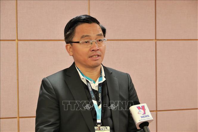 CEO of Hoang Anh Gia Lai FC Nguyen Tan Anh gives an interview to VNA correspondent at Cheonan stadium. VNA Photo: Khánh Vân 