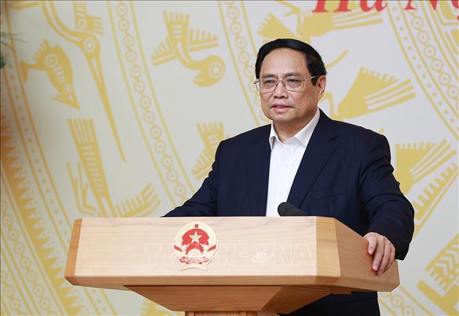 Minister Pham Minh Chinh chairs a conference on solutions to innovate the operation of the Committee for Management of State Capital at Enterprises. VNA Photo: Dương Giang