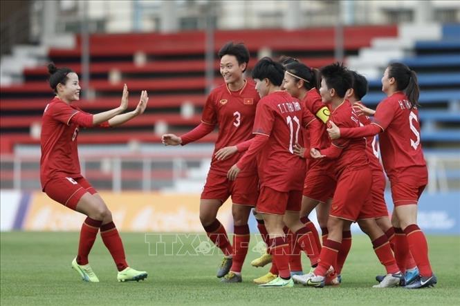 Vietnamese players celebrate their first goal scored by Hai Yen (12) at the 4th minute of the match. VNA Photo: Minh Quyết