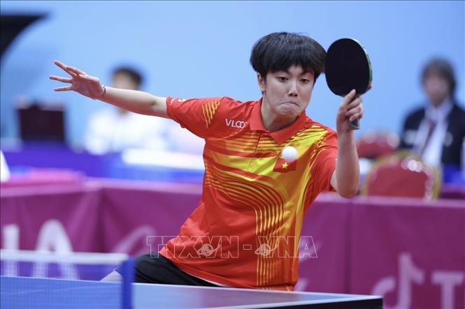 Cặp VĐV Đinh Anh Hoàng và Trần Mai Ngọc (ảnh) thi đấu vòng 1/16 gặp đôi VĐV J. Choong và Karen (Malaysia) nội dung đôi nam nữ. Ảnh: Minh Quyết - TTXVN