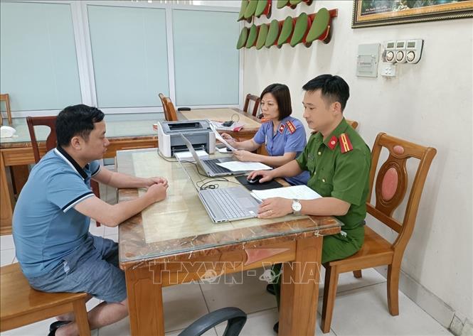 Trong ảnh: Đối tượng Đào Quang Hiệp tại Cơ quan công an. Ảnh: TTXVN phát
