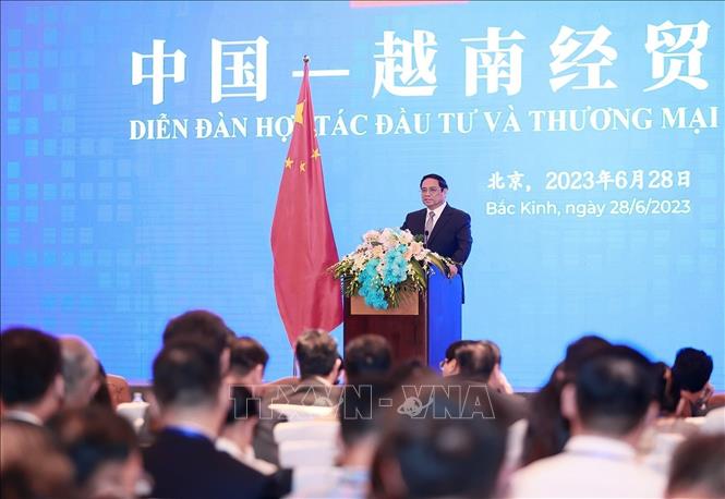 Prime Minister Pham Minh Chinh speaks at the Vietnam-China Trade and Investment Cooperation Forum in Beijing on June 28. VNA Photo: Dương Giang