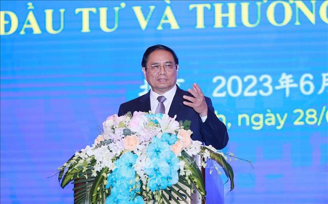 Prime Minister Pham Minh Chinh speaks at the Vietnam-China Trade and Investment Cooperation Forum in Beijing on June 28. VNA Photo: Dương Giang