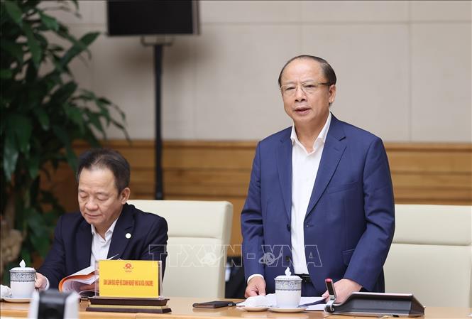 Chủ tịch Hiệp hội Doanh nghiệp nhỏ và vừa Nguyễn Văn Thân báo cáo tình hình hoạt động của các doanh nghiệp. Ảnh: Dương Giang-TTXVN

