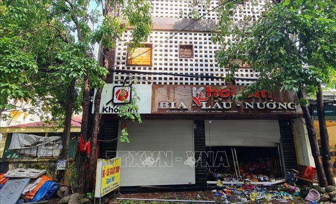 Ttong ảnh: Cửa chính ngôi nhà kết kợp kinh doanh xảy ra vụ cháy. Ảnh: Vũ Hà- TTXVN