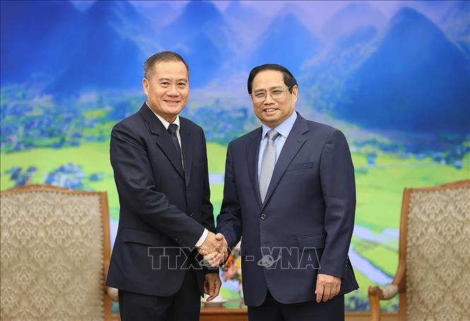 Thủ tướng Phạm Minh Chính tiếp Tổng Giám đốc Thông tấn xã Pathet Lào (KPL) Khampheuy Philapha. Ảnh: Dương Giang-TTXVN