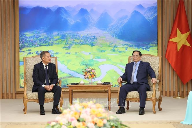 Thủ tướng Phạm Minh Chính tiếp Tổng Giám đốc Thông tấn xã Pathet Lào (KPL) Khampheuy Philapha. Ảnh: Dương Giang-TTXVN